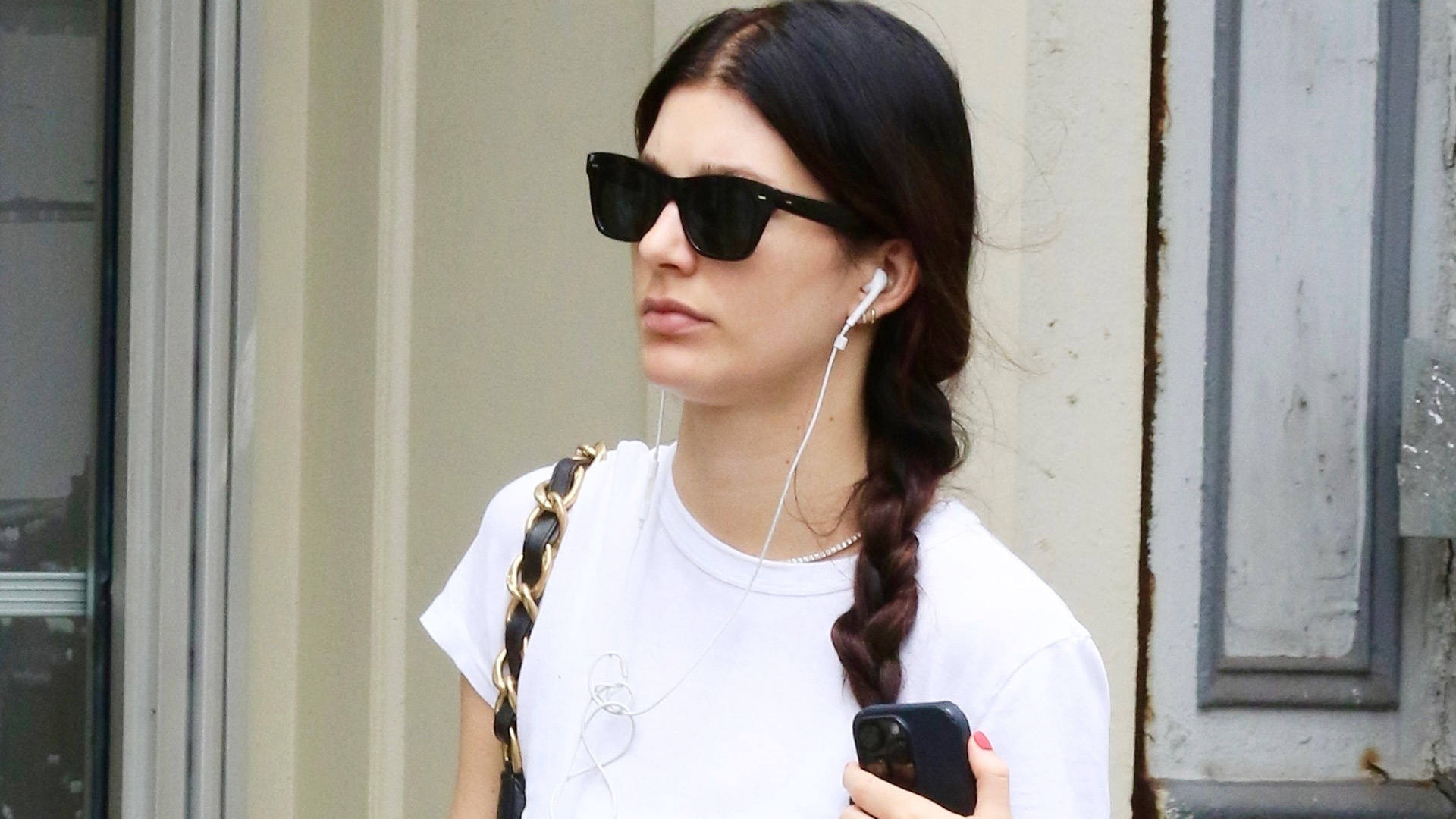 Camila Morrone wearing a white T-shirt