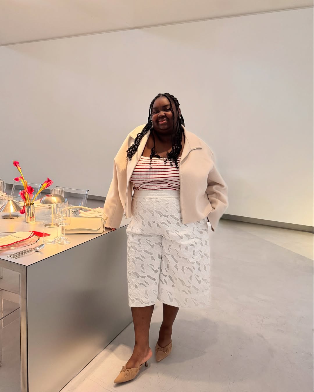 White shorts and cropped jacket on Abisola