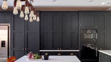 kitchen with dark kitchen cabinets by Bespoke kitchen designers Higham Furniture