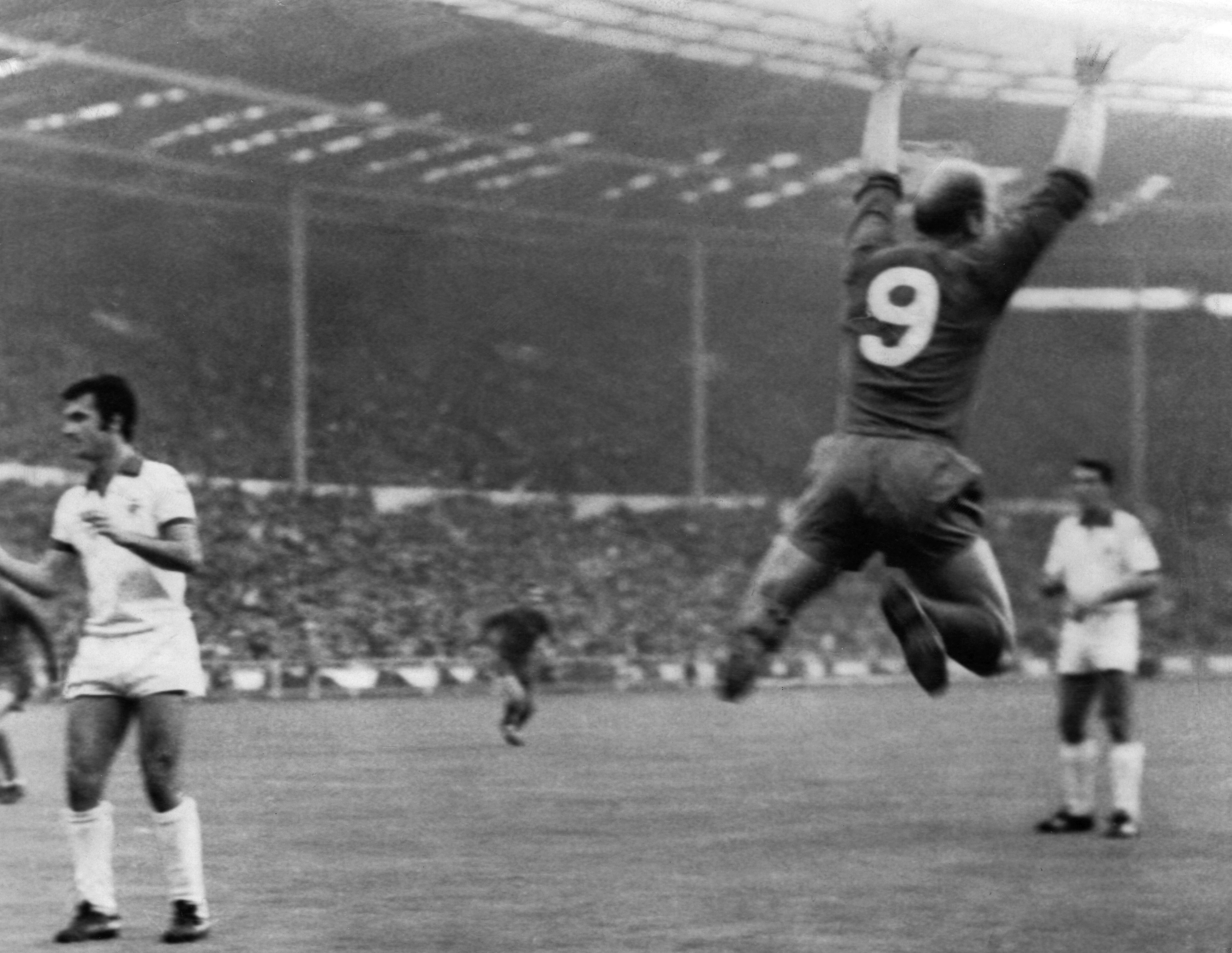 Bobby Charlton celebrates after scoring Manchester United's first goal against Benfica in the 1968 European Cup final.
