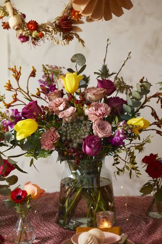 Bright colored Christmas flower arrangement by Bloom & Wild