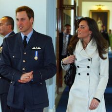 britains prince william l is pictured with his girlfriend kate middleton after his graduation ceremony at raf cranwell air base in lincolnshire, on april 11, 2008 britains prince william graduated as a royal air force raf pilot on friday after successfully completing an intensive flying coursethe prince, 25, received his wings from his father prince charles in a graduation ceremony at the raf cranwell air base in lincolnshire, east central england afp photopaul ellispool photo credit should read paul ellisafp via getty images