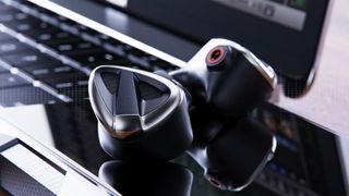 FiiO FH19 hybrid IEMS on a laptop