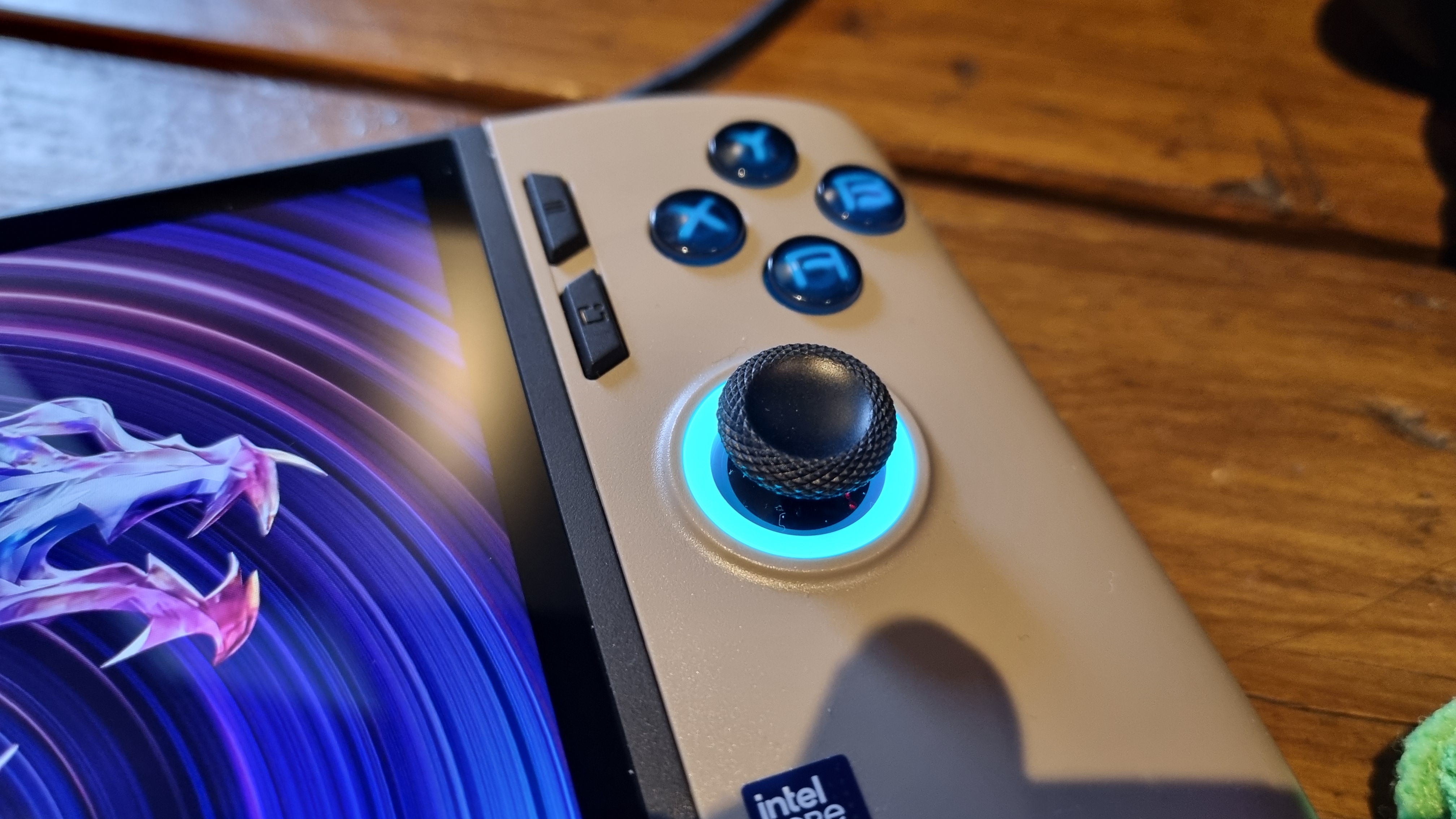 The right thumbstick of the MSI Claw 8 AI+, ringed in blue RGB