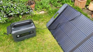 Ugreen PowerRoam 1200 Power Station plugged into a 200 watt solar panel during our review