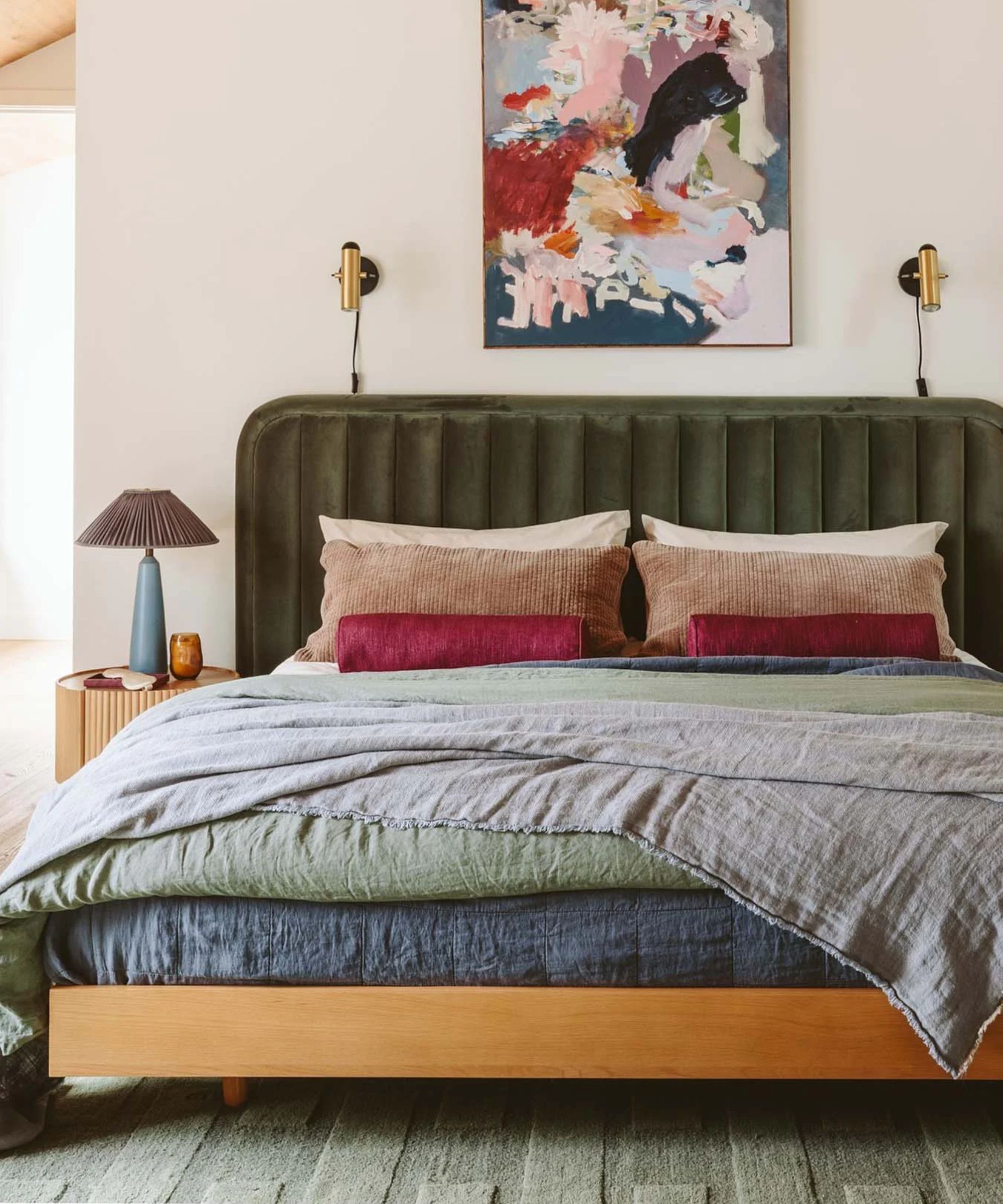 neutral and forest green layered bedroom designed by Emily Henderson