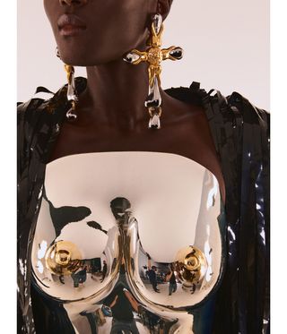 Woman wearing a silver breastplate