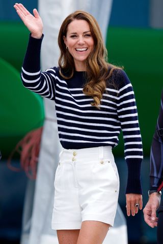 Kate Middleton wears a navy striped jumper as she visits the 1851 Trust and the Great Britain SailGP Team on July 31, 2022 in Plymouth, England.
