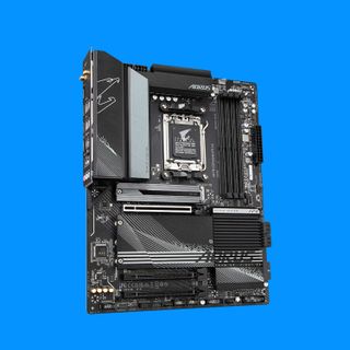 Gigabyte X670 Aorus Elite AX motherboard against a blue background