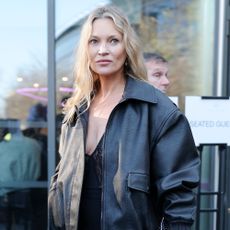 Kate Moss wears a black leather jacket