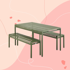 Aldi metal dining bench on a pink background.