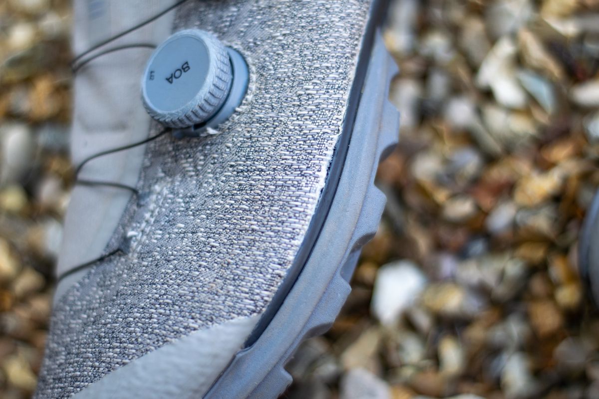 A pair of Rapha Pro Team Gravel shoes on some gravel