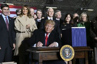 President Donald Trump signs S.1790, the National Defense Authorization Act for Fiscal Year 2020, on Dec. 20, 2019, at Joint Base Andrews. The act directed the establishment of the U.S. Space Force as the sixth branch of the armed forces.