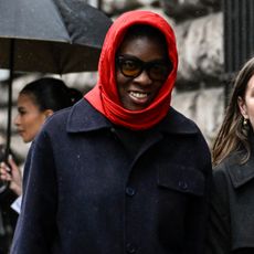Nikki Ogunnaike wearing a scarf and a coat