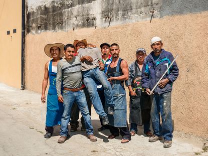 Group of Mexican men posing for the camera