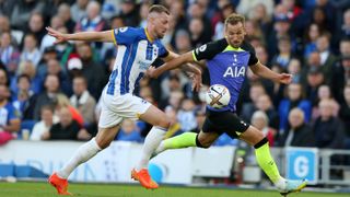 Harry Kane of Tottenham Hotspur is challenged by Adam Webster of Brighton & Hove Albion during the Premier League match between Brighton & Hove Albion and Tottenham Hotspur 