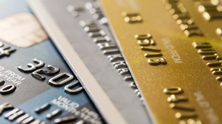 A macro image of several credit cards stacked on top of each other.