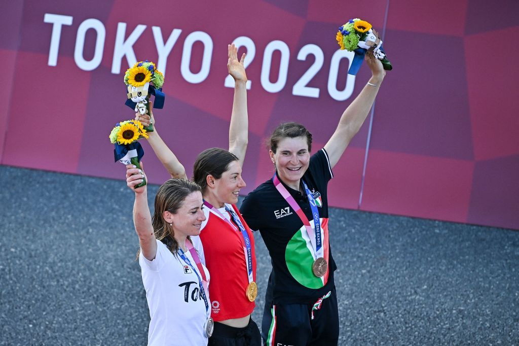 LR Silver medallist Netherlands Annemiek Van Vleuten Gold medallist Austrias Anna Kiesenhofer and bronze medallist Italys Elisa Longo Borghini celebrate on the podium during the medal ceremony for the womens cycling road race of the Tokyo 2020 Olympic Games at the Fuji International Speedway in Oyama Japan on July 25 2021 Photo by Ben STANSALL AFP Photo by BEN STANSALLAFP via Getty Images