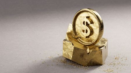 Gold coin with dollar sign sitting on top of a rough hewn chunk of solid gold.