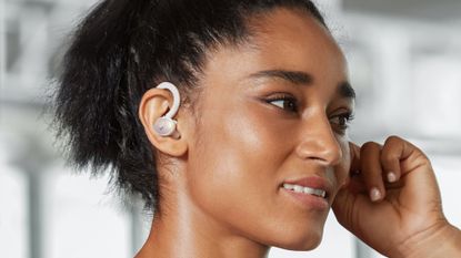 Best running headphones: athlete wearing the Soundcore Sport X10 headphones
