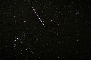 Astrophotographer Dennis Mammana caught a Geminid fireball streaking near the stars of Orion.