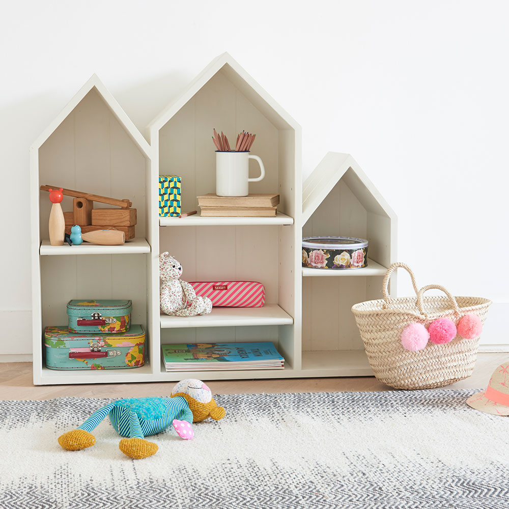triplet bookcase with storage unit and wooden flooring