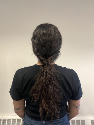 photo of Gabrielle Ulubay from the back with a twisted low ponytail