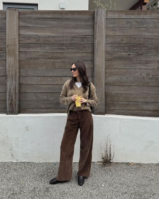 @livvperez wearing brown cords and v-neck jumper