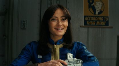 Ella Purnell wearing a Pip-Boy in Fallout