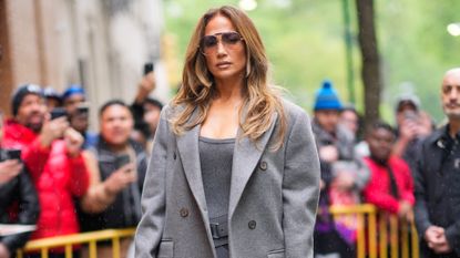 Jennifer Lopez in grey furry coat.