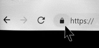 A close-up of a cursor on a computer monitor, pointing to the padlock next the the web address