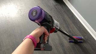 Dyson Micro 1.5kg being used to clean hard wood floors