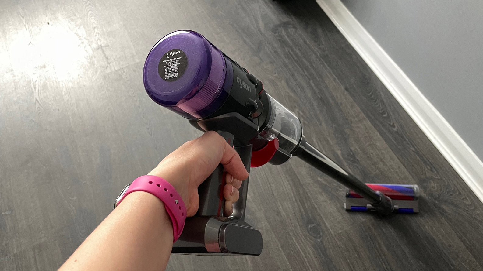 Dyson Micro 1.5kg being used to clean hard wood floors