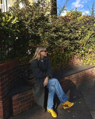 Fashion influencer Lucy Williams in London wearing the colorful sneaker trend.