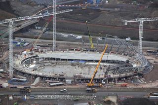 Construction of the Olympic velodrome's sweeping roof is underway