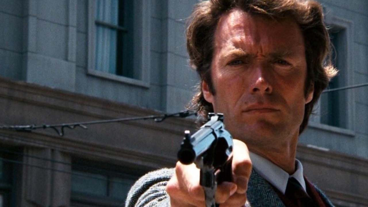 'Dirty' Harry Callahan raises his gun to someone off camera in 1971 movie Dirty Harry