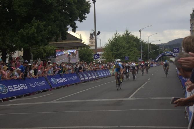 Kimberley Wells about to raise her arms in triumph at winning the 2015 national criterium title in Ballarat