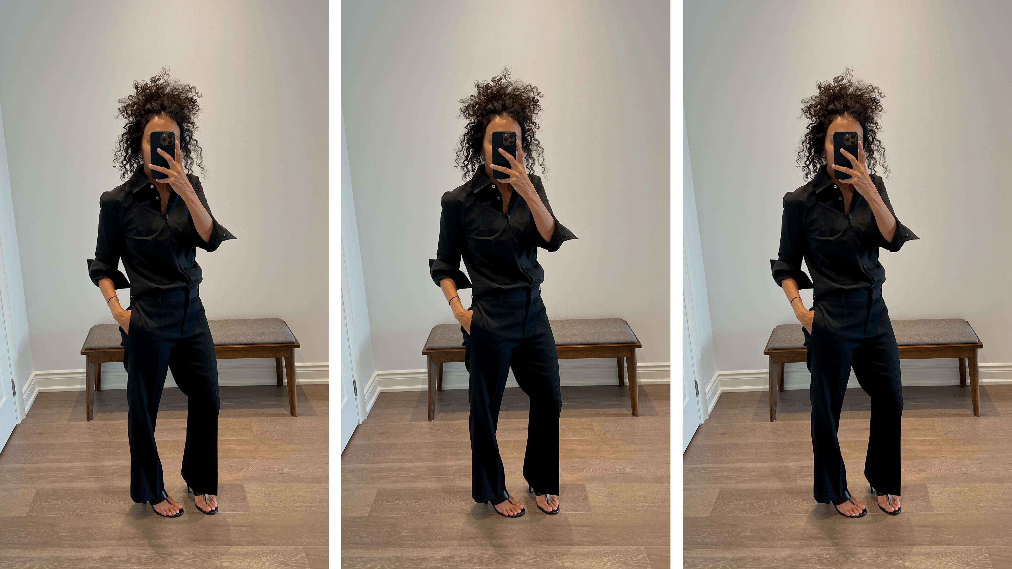 Neelam wears a black button-down top, black trousers, and black Signum heels.