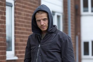 Charley Palmer Rothwell as Mark Brannon wearing a hoodie and jacket.