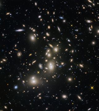 Abell 2744, nicknamed Pandora’s Cluster, was the first of six targets within the Frontier Fields programme, which together have produced the deepest images of gravitational lensing ever made. The cluster is thought to have a very violent history, having formed from a cosmic pile-up of multiple galaxy clusters.