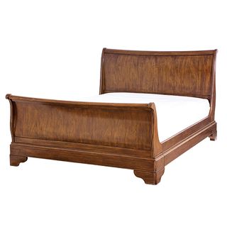 Provence wooden sleigh bed with white bedlinen