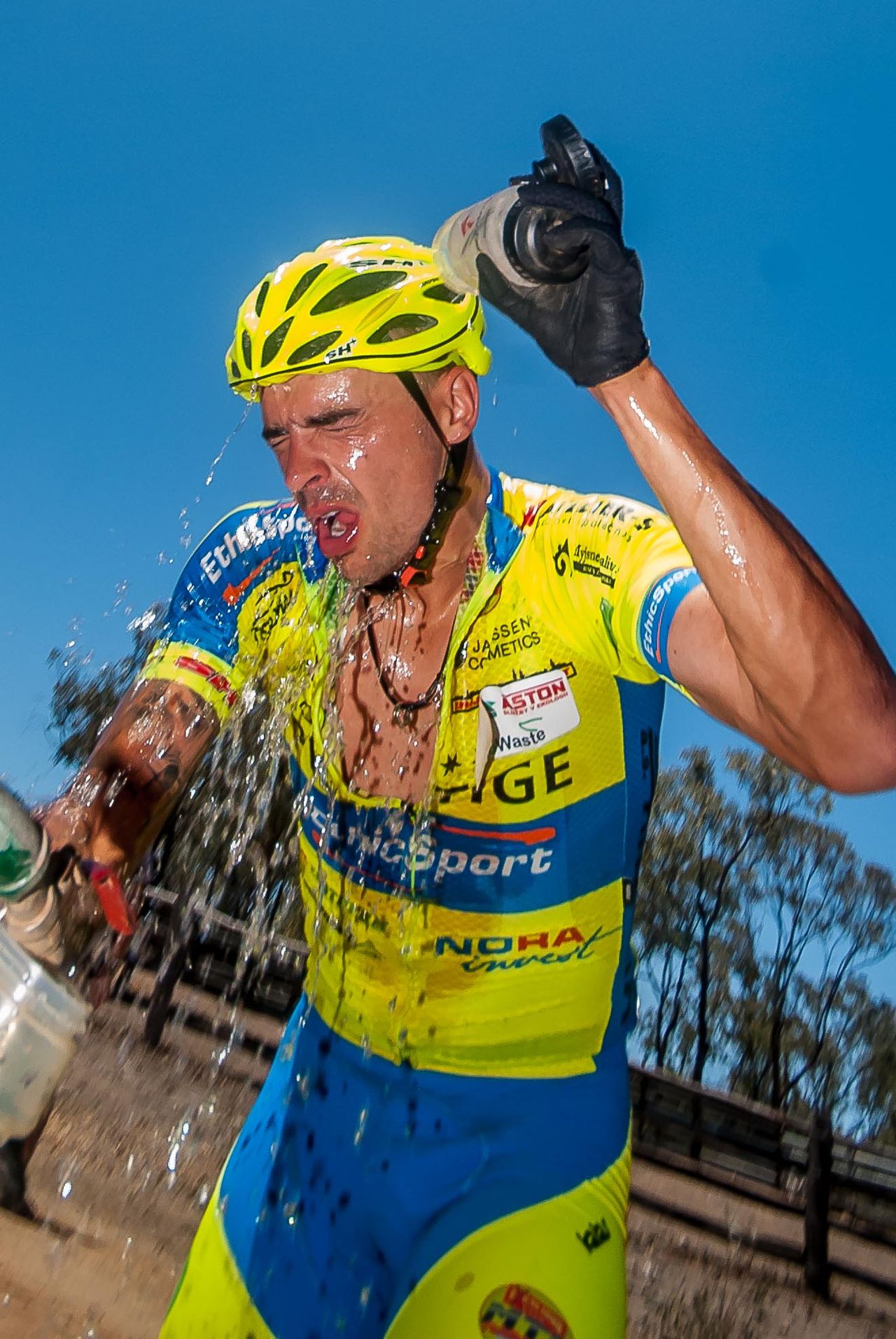 It's important for riders to replenish with plenty of fluids at the feedzones; an additional depot was installed today to assist riders - here Jiri Krivanek (CZE) tries to cool down.