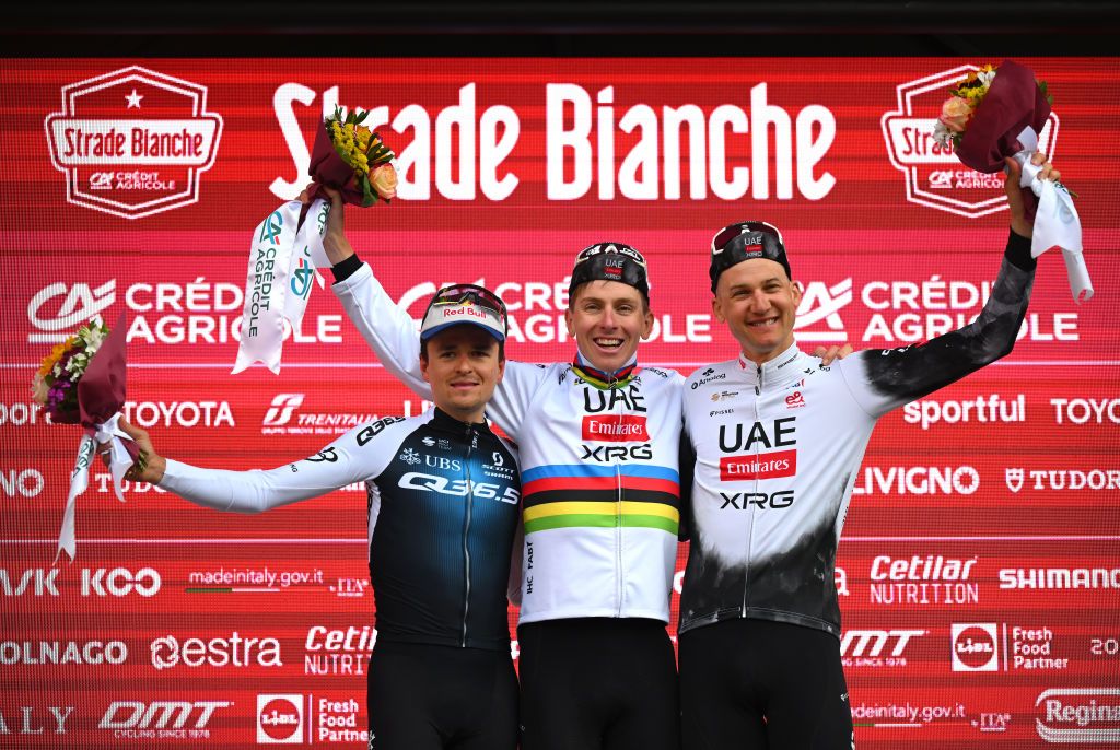 SIENA ITALY MARCH 08 LR Tom Pidcock of The United Kingdom and Q365 Pro Cycling Team on second place race winner Tadej Pogacar of Slovenia and UAE Team EmiratesXRG and Tim Wellens of Belgium and UAE Team EmiratesXRG on third place pose on the podium ceremony after the 19th Strade Bianche 2025 Mens Elite a 213km one day race from Siena to Siena 320m UCIWT on March 08 2025 in Siena Italy Photo by Tim de WaeleGetty Images