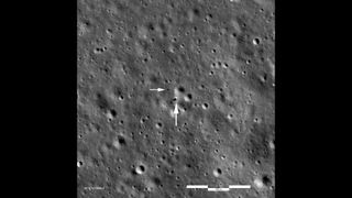 From above we see the Chang'e-4 landing site. The lander itself sits at the end of the large arrow and the rover sits at the tip of the smaller arrow.