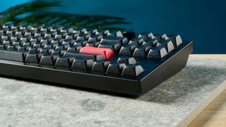 A photo of the Keychron Q3 Max on a stone surface showing the aluminum case