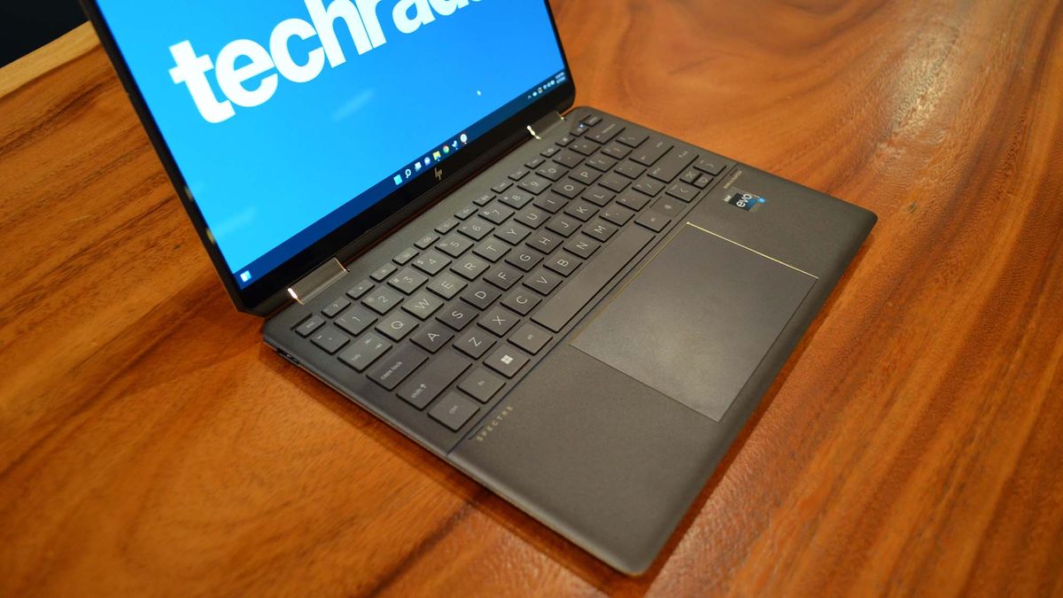 An HP Spectre x360 2022 on a wooden table