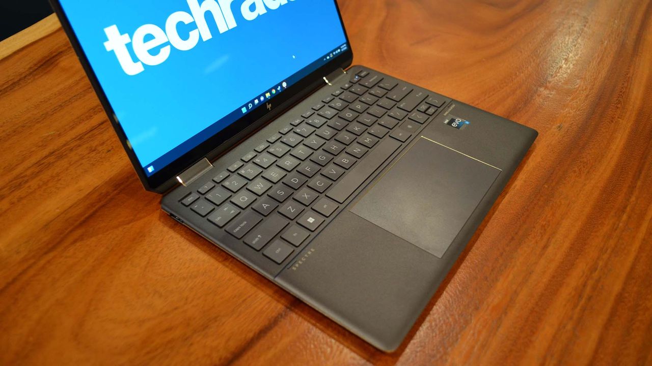 An HP Spectre x360 2022 on a wooden table