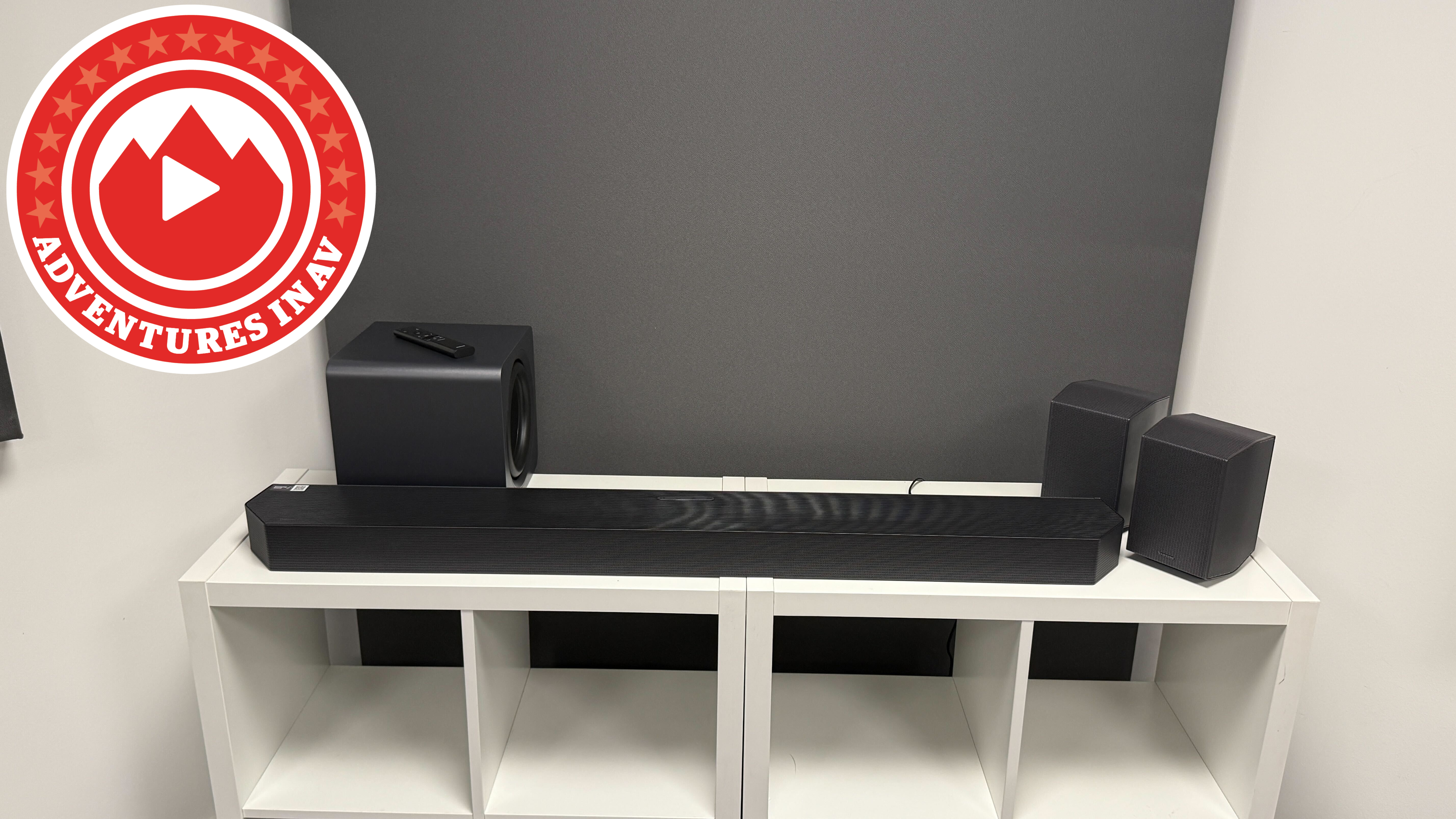 A Samsung HW-Q990H soundbar system on a white unit with an Adventures in AV logo in the top left