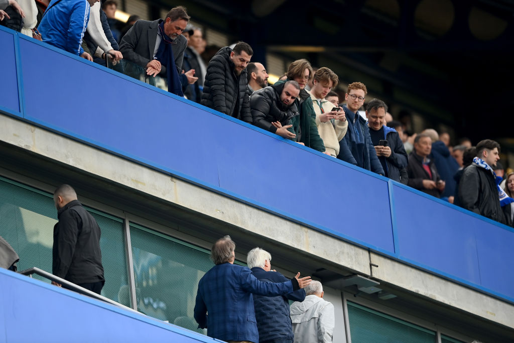  Todd Boehly, Chairman of Chelsea, speaks to fans within the midst of the Premier League match between Chelsea FC and Brighton & Hove Albion at Stamford Bridge on April 15, 2023 in London, England