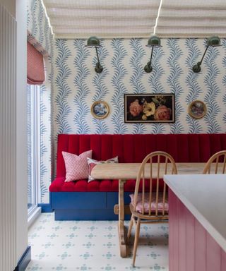 Dining look with red seating and blue and white wallpaper